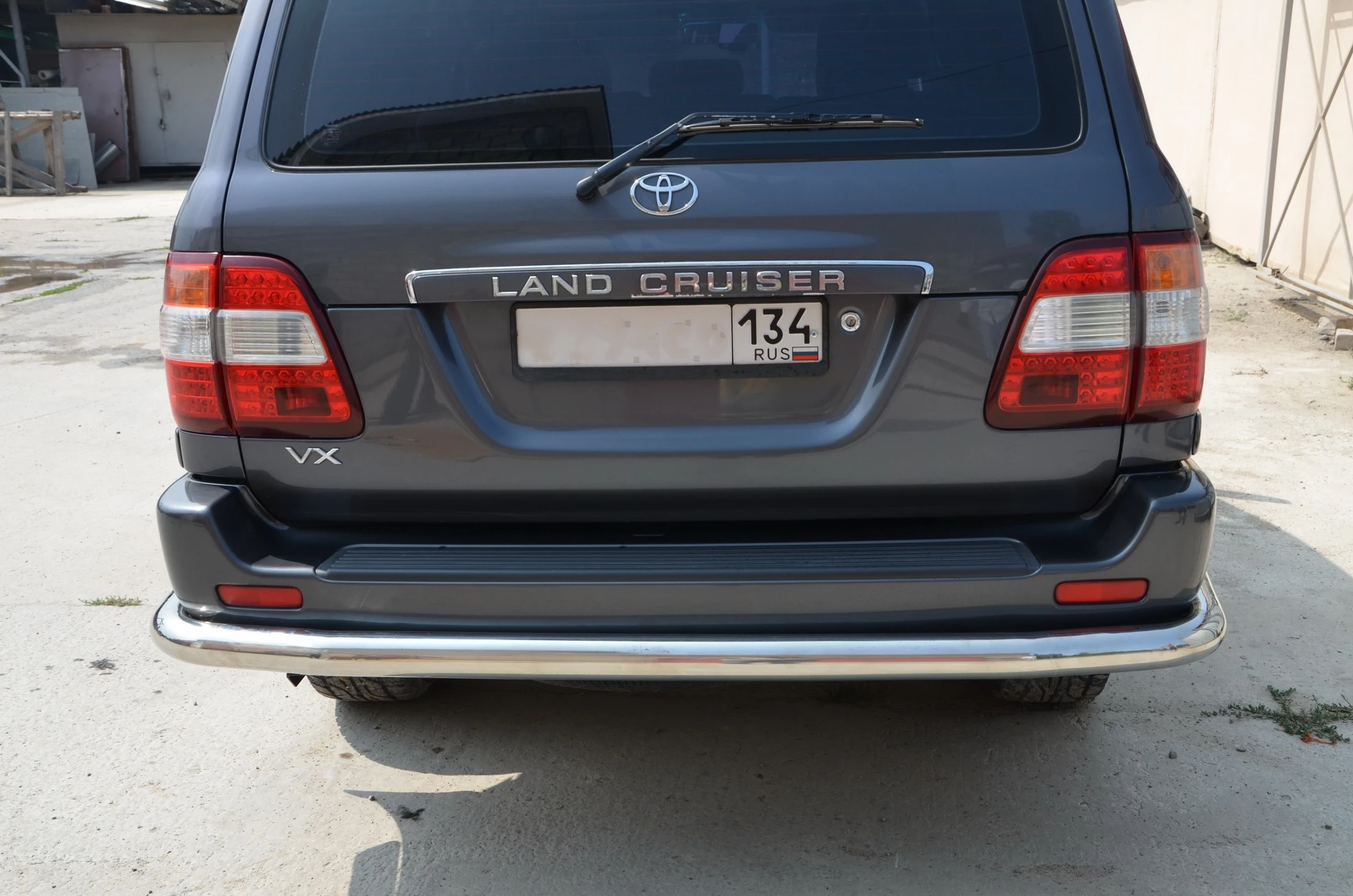 Защита заднего бампера угловая большая d76 мм для Toyota Land Cruiser 100 Series  Юко TLC100.98.18