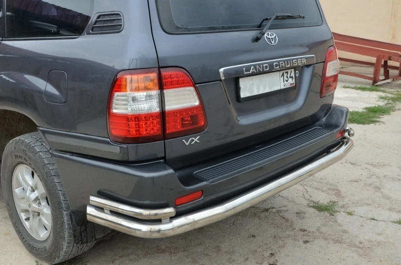 Защита заднего бампера угловая большая двойная d76/42 мм для Toyota Land Cruiser 100 Series Рестайлинг 1  Юко TLC100.98.21